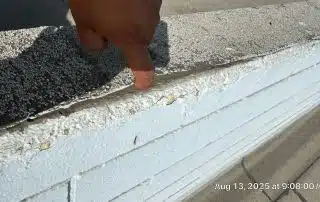 2-Aug 13 2025 09_08am-RJux Hand pointing at cracked concrete surface