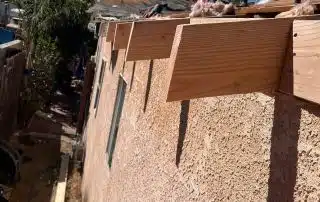 House roofing under construction with blue sky