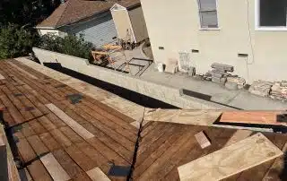 House roof construction with wood boards laid out.