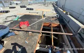 5-Aug 22 2025 04_05pm-ZPGv Rooftop under construction with tools and open hatch.