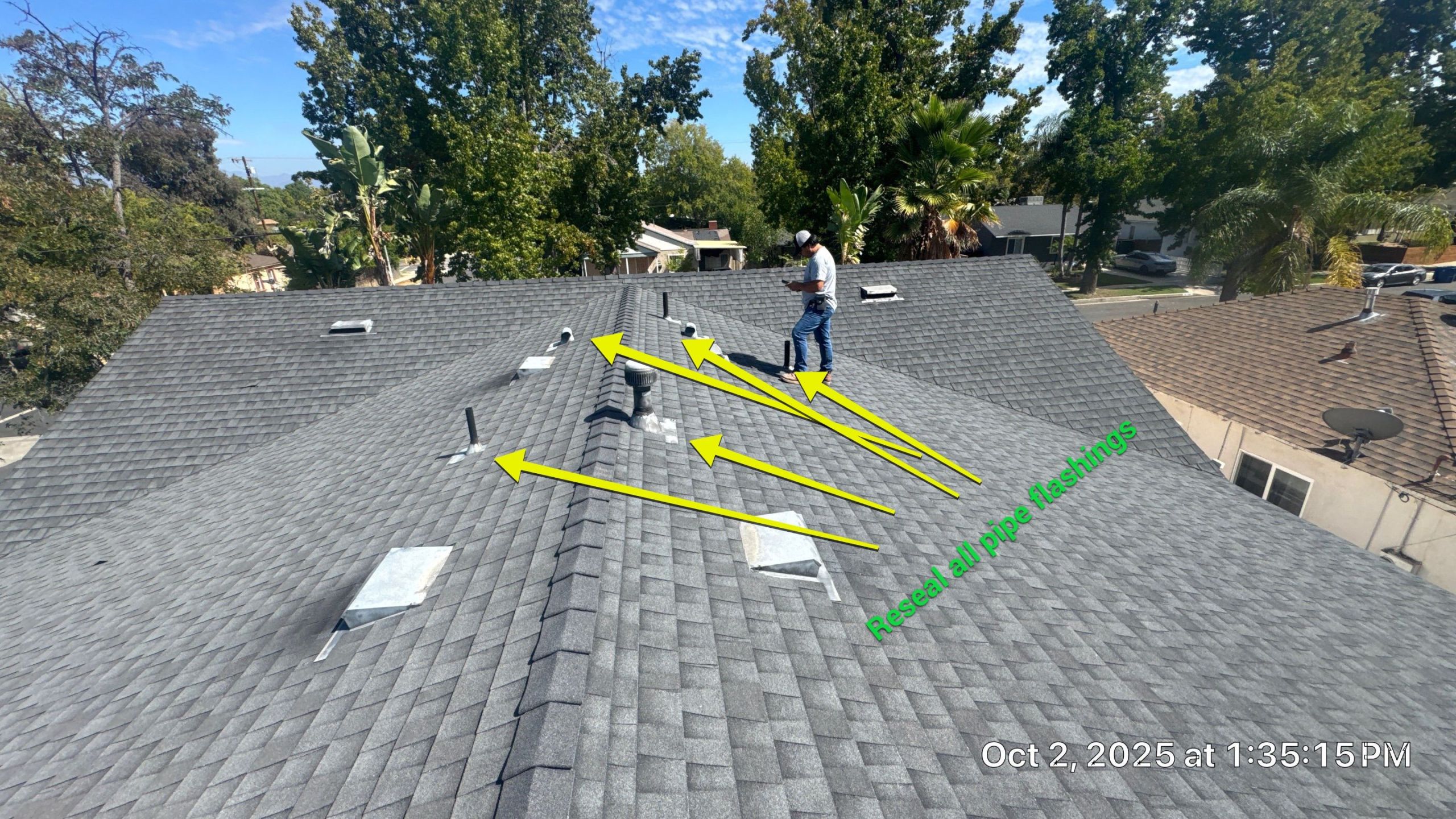 Inspecting roof pipe flashings for resealing.