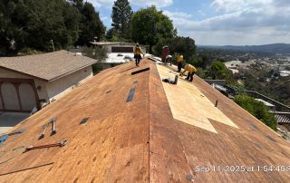 3-Sep 11 2025 01_54pm-ScZK Roofers working on wooden roof structure repair.