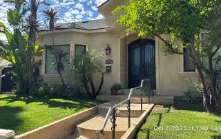 Front of house with lush garden