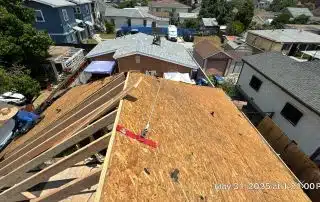 Rooftop construction in suburban neighborhood view