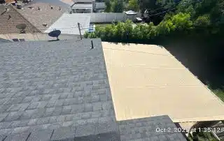 View of rooftops and a garden.
