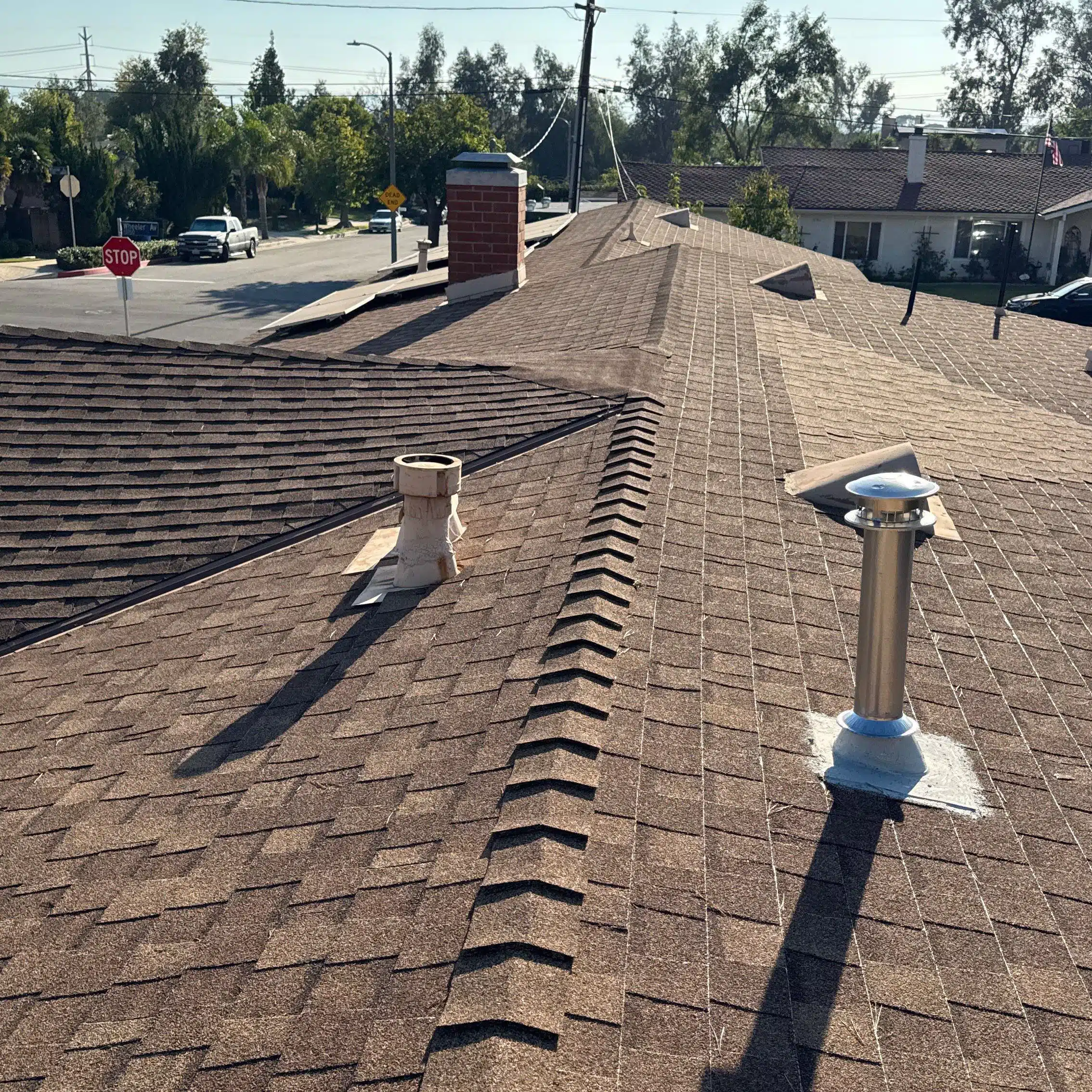 Residential rooftop with shingle and chimney details