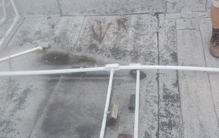 12-Dec 25 2025 01_08pm-NgS3 Rooftop with pipeline and damaged surface.