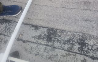 13-Dec 25 2025 01_09pm-5DXh Person on roof with sneakers and pole