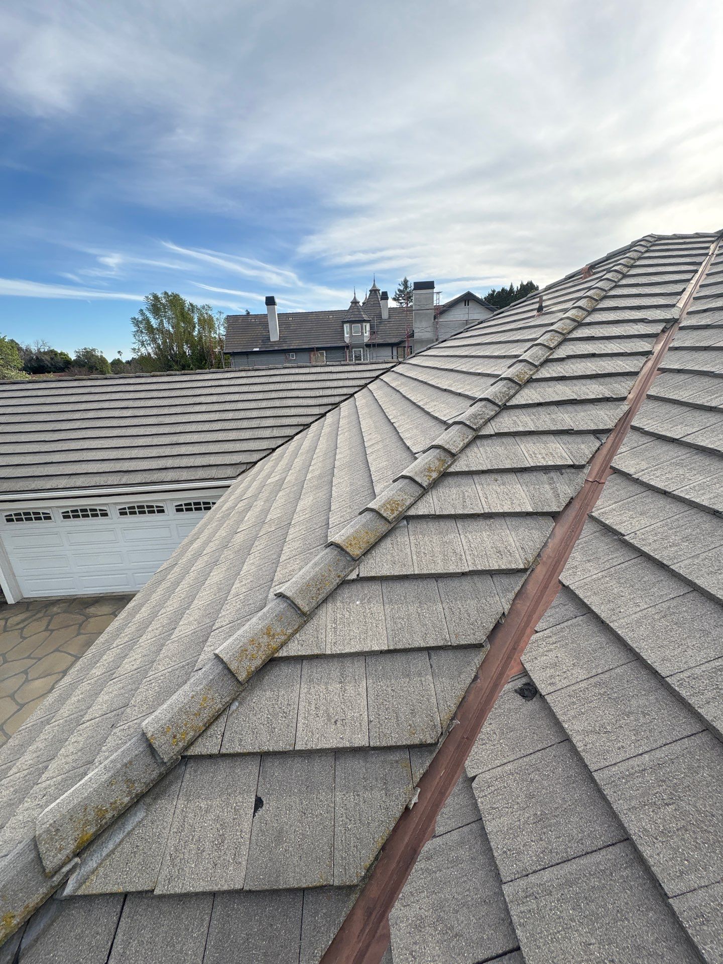 2-Feb 12 2026 03_17pm-Tbi4 View of residential rooftops under cloudy sky.
