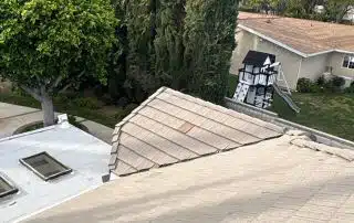 View from rooftop showing yard and trees.
