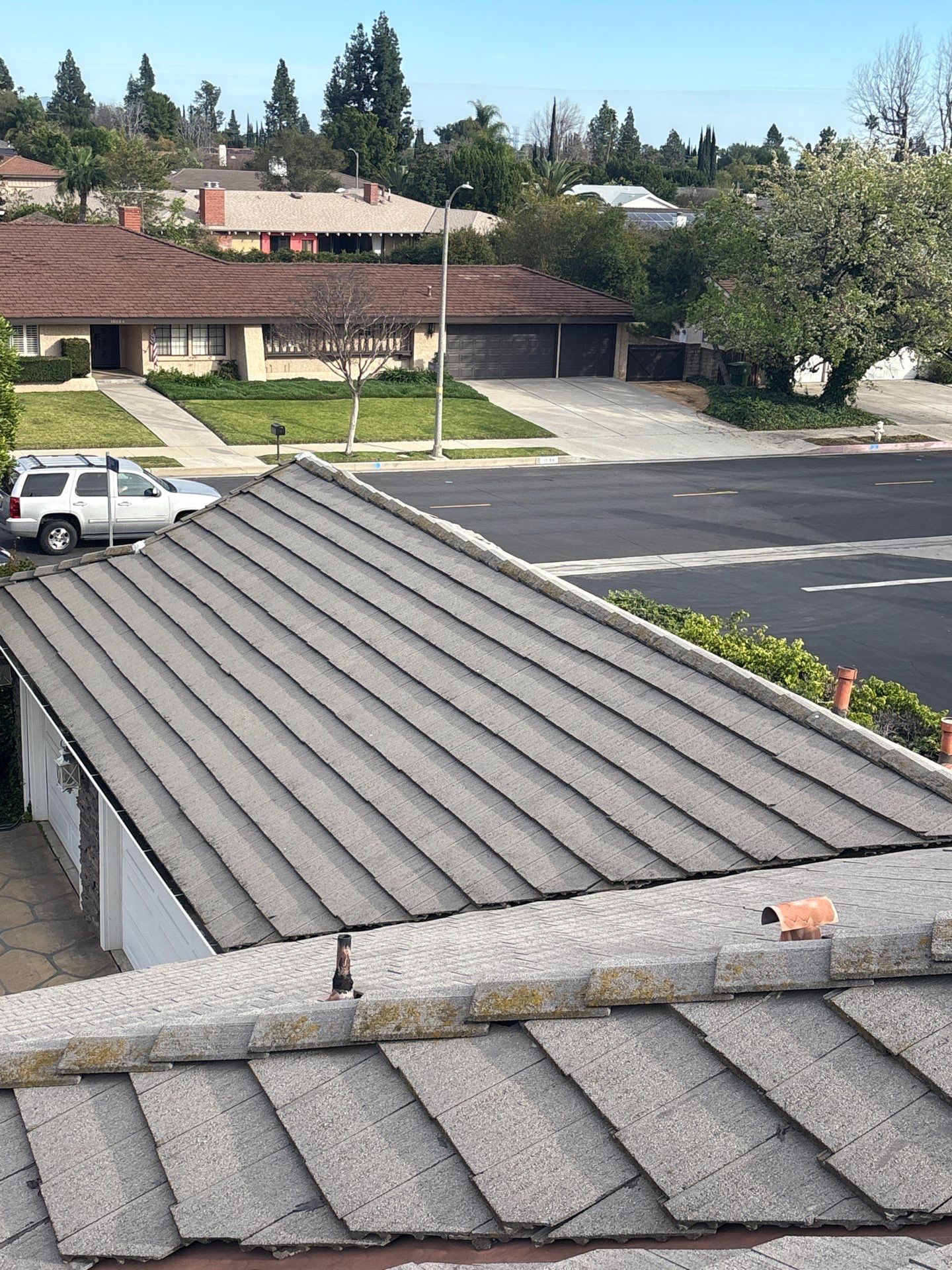 26-Feb 12 2026 03_24pm-kfBN Suburban neighborhood with houses and rooftops from above.