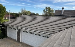 32-Feb 12 2026 03_28pm-hjJg Residential roof with garage and blue sky