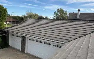 Residential roof with garage and blue sky