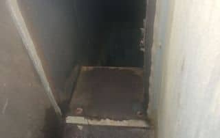 4-Dec 25 2025 12_43pm-6GcF Dark narrow ventilation duct with cobwebs.