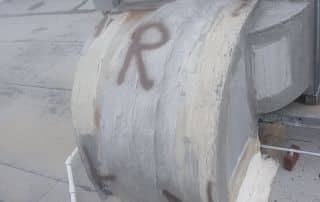 5-Dec 25 2025 01_03pm-kika Rooftop duct with graffiti arrow and 'R' letter.