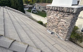 5-Feb 12 2026 03_17pm-CqNi Rooftop view with chimney and backyard landscape.