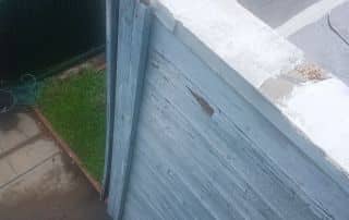 6-Dec 25 2025 01_03pm-GQqv Damaged wooden siding with peeling paint.