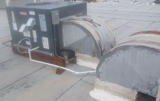 7-Dec 25 2025 01_03pm-oZzi Rooftop HVAC unit installation on commercial building.