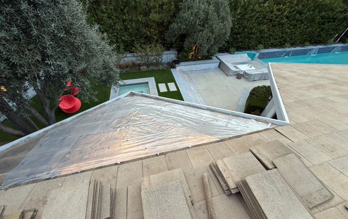 Rooftop renovation overlooking modern backyard with pool