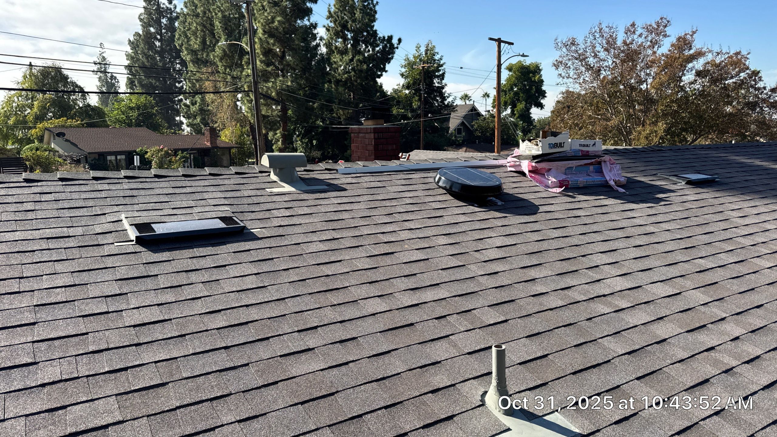 Asphalt shingle roof with vents and chimney