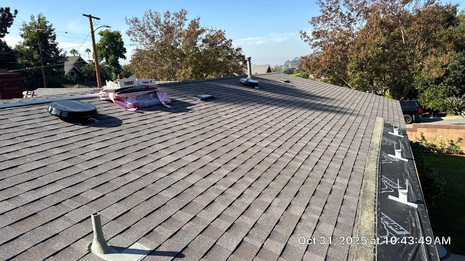 Corroded chimney roof flashing with visible gap and rust staining on a California coastal home